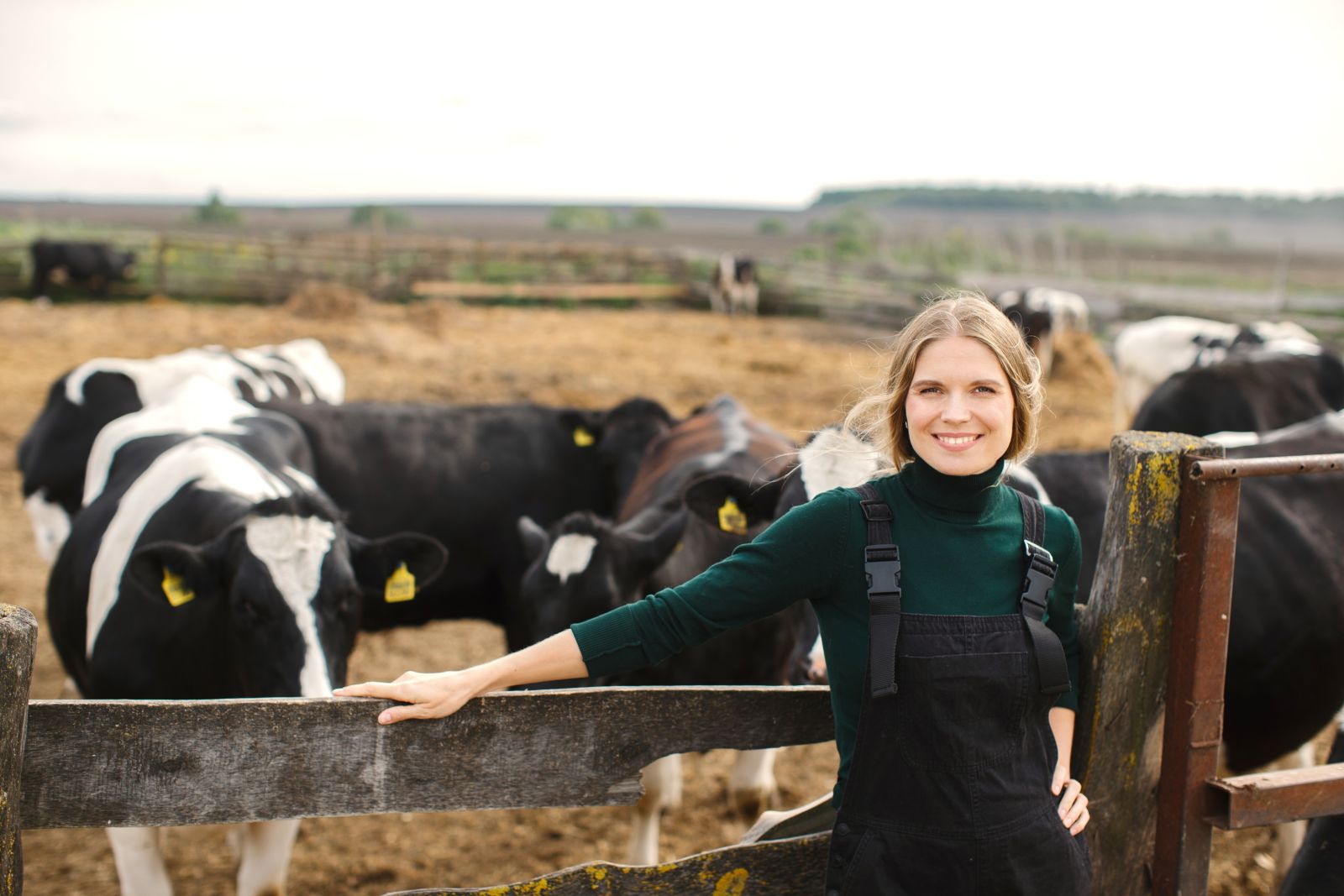 farmer shaking hands with man in field